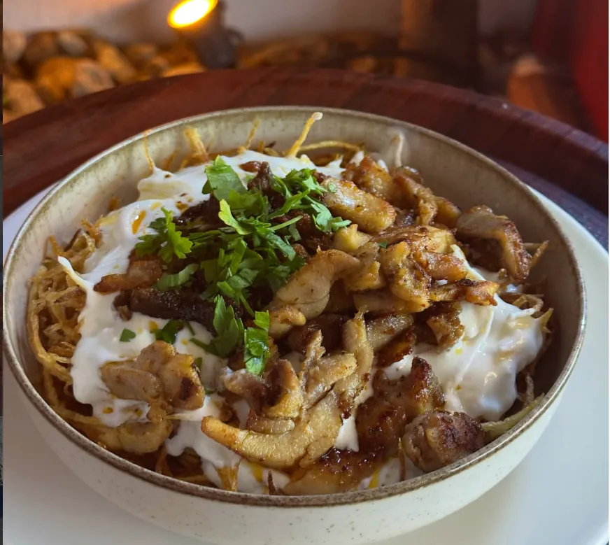 A dish served with yoghurt and parsley